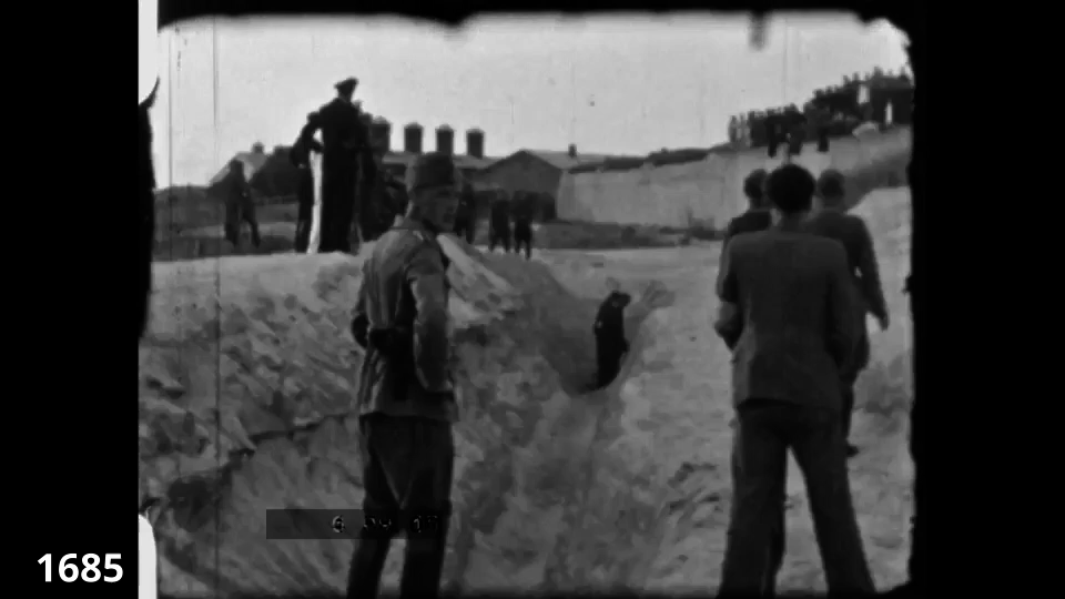 Screenshot from the Wiener Film mass execution in Liepaja 1942 fc 1685 - Jews are being shot at close range in a sand pit